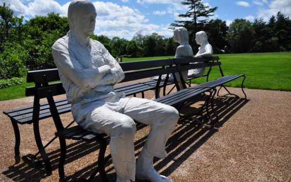 statues on park bench